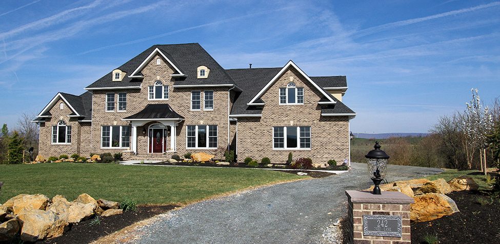 The Stately Manor   Premier Custom Homes Country side estate with brick entrance features.